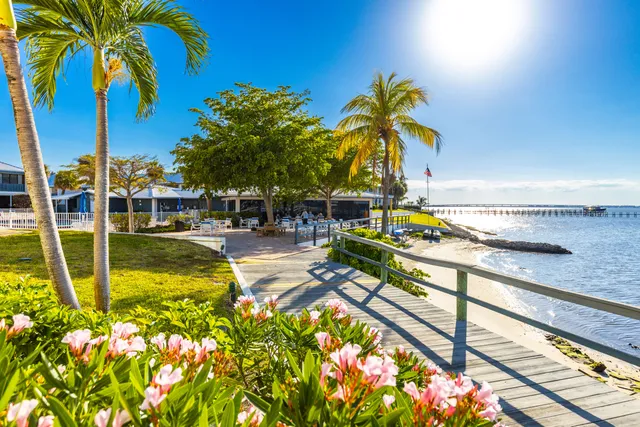 a swimming pool with outdoor seating and yard