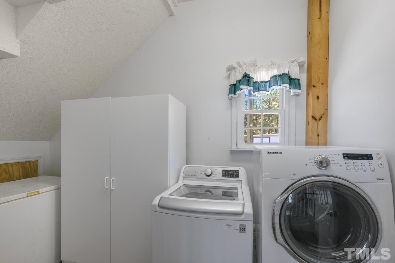 509 Surles Road Benson, NC 27504 - Photo 14 of 30 a utility room with dryer and washer