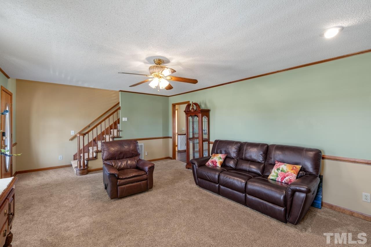 509 Surles Road Benson, NC 27504 - Photo 8 of 30 a living room with furniture and stairs