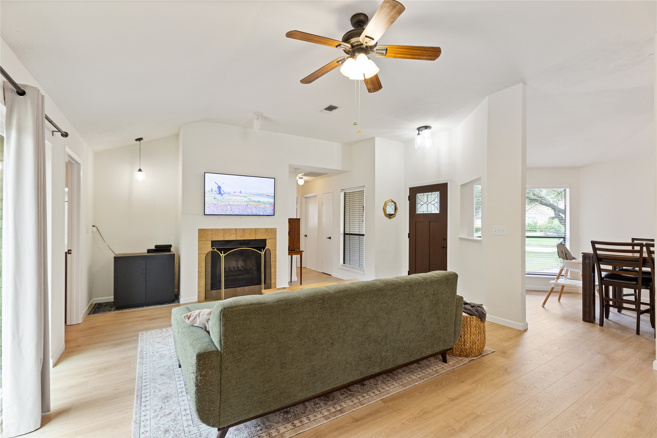9719 Orangevale Drive Spring, TX 77379 - Photo 9 of 32 Den opens to dining area creating a lovely space for gathering and entertaining.