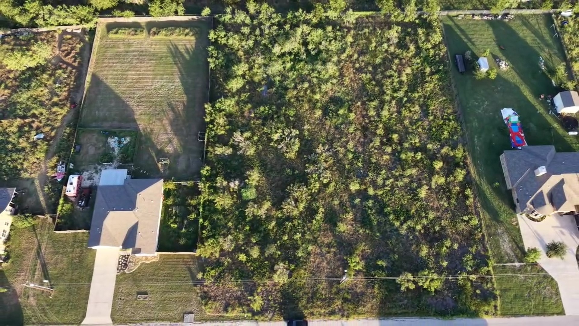 232 East Ridge Lane Kyle, TX 78640 - Photo 5 of 36 A spacious, buildable lot offering ample green space and a serene neighborhood setting.