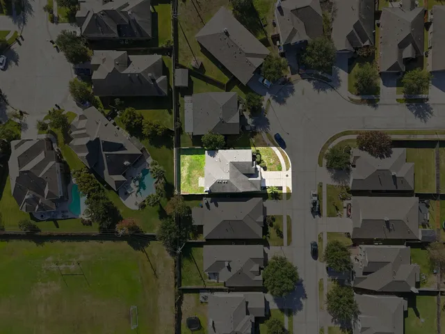 an aerial view of house with yard swimming pool and outdoor seating