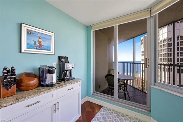 a kitchen with stainless steel appliances granite countertop a cabinets and a window