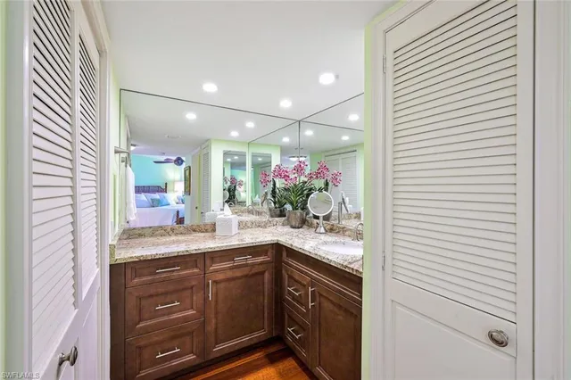 a kitchen with a sink and cabinets