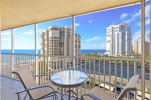 a view of a balcony dining area with furniture