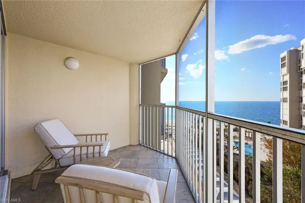 a view of balcony with furniture