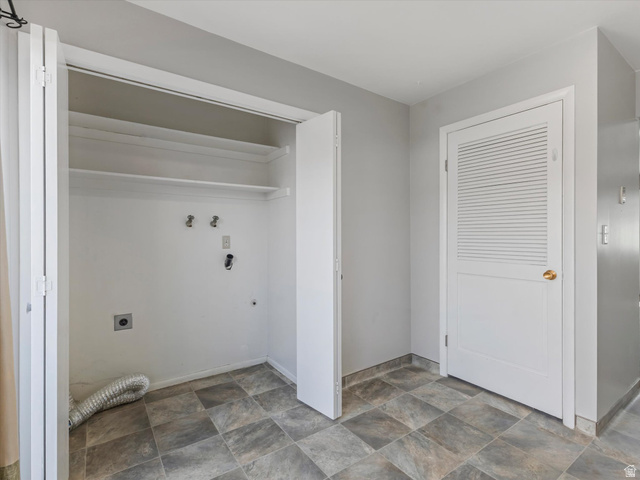 1478 North 75 West, Unit AD Sunset, UT 84015 - Photo 11 of 26 Laundry area with stone finish floors, hookup for an electric dryer, and hookup for a washing machine