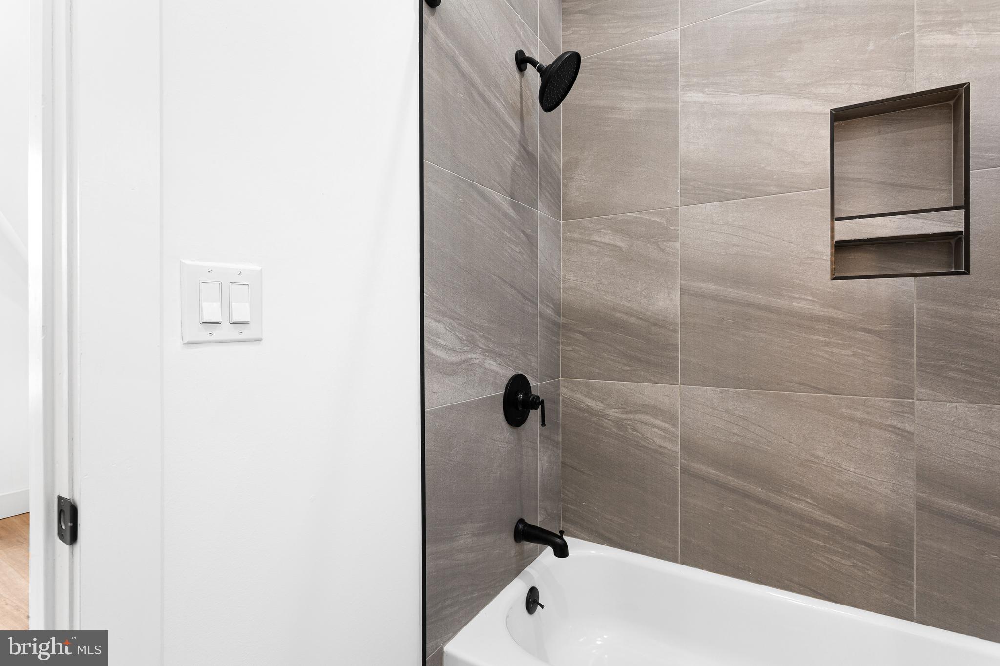 2317 North 33rd Street, Unit D Philadelphia, PA 19132 - Photo 5 of 12 a bathroom with a bathtub