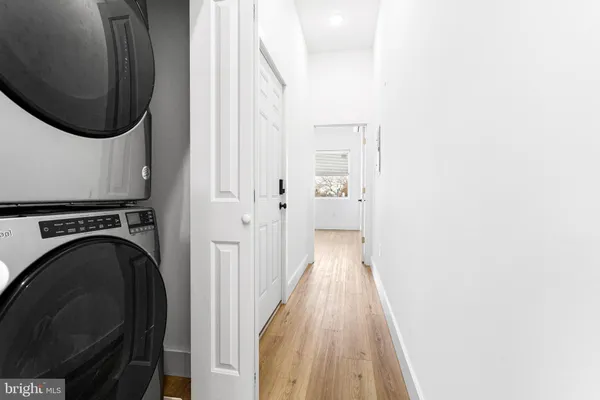 a view of a hallway with washer and dryer