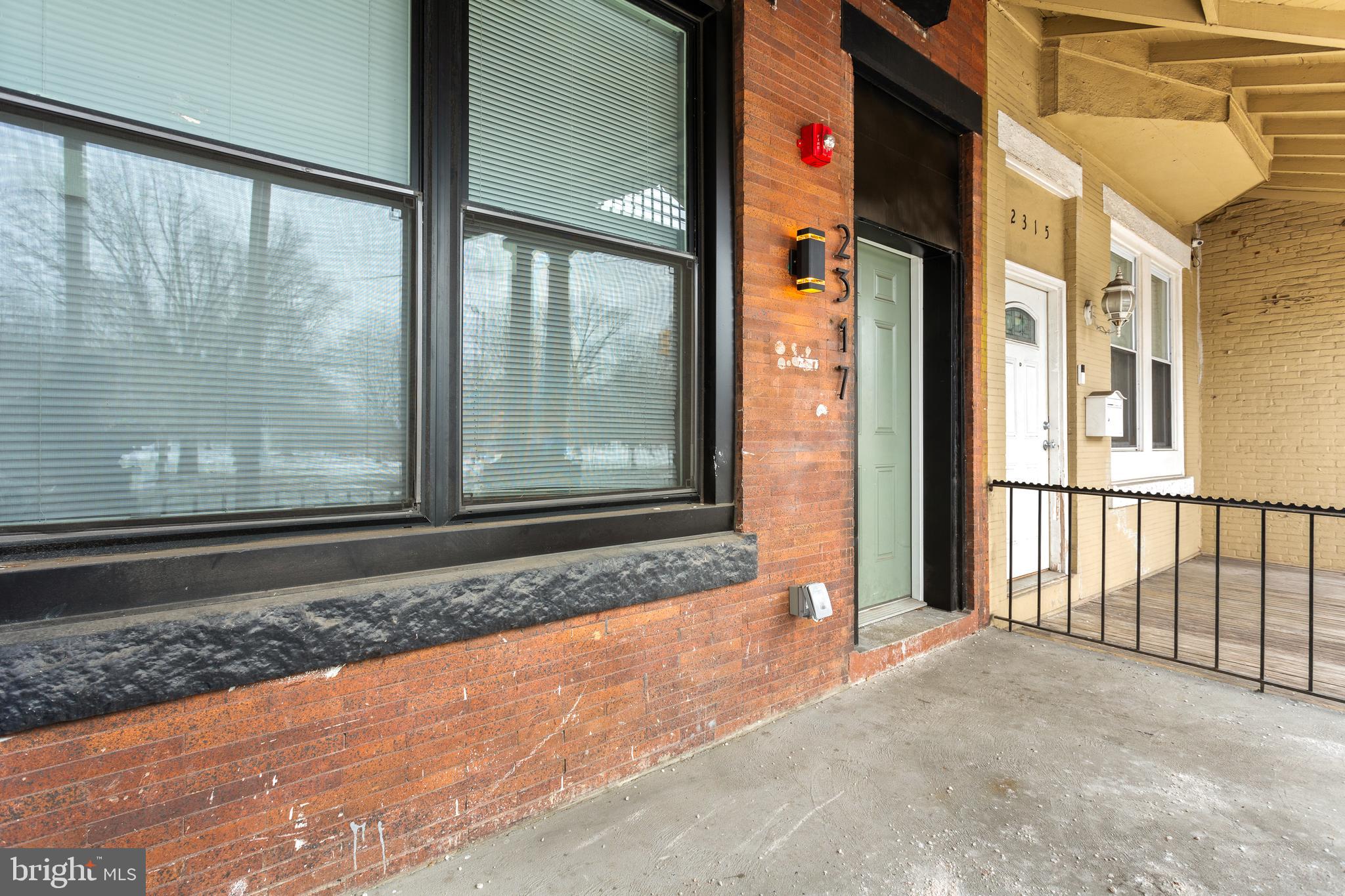 2317 North 33rd Street, Unit D Philadelphia, PA 19132 - Photo 10 of 12 a view of a brick house with a large window