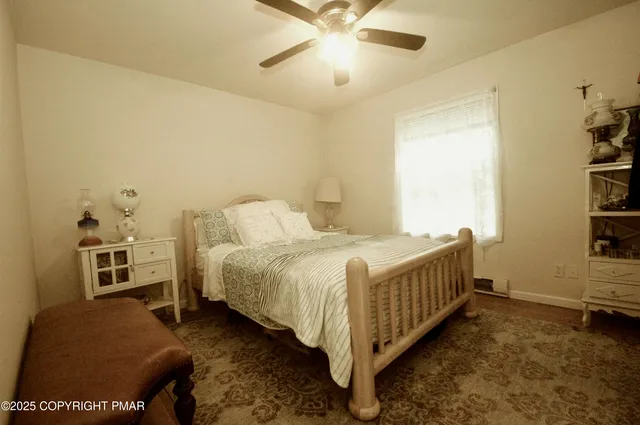 a bedroom with a bed and a book shelf
