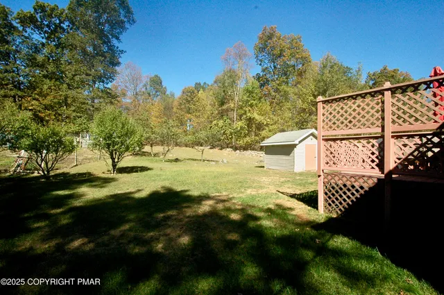 a view of a backyard of the house