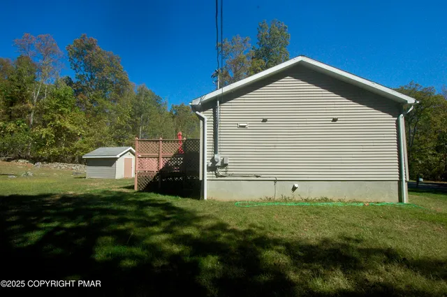 a view of a backyard of the house