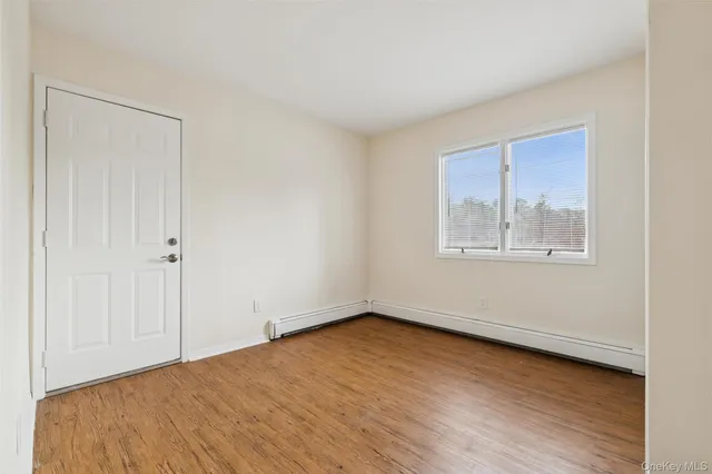 a front view of a house with a road