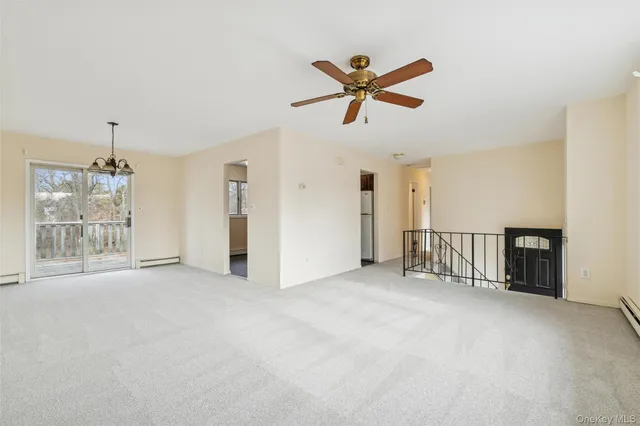 a view of empty room with windows