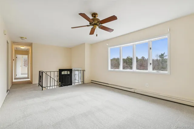 a kitchen with stainless steel appliances granite countertop a stove a sink dishwasher and a refrigerator with wooden cabinets