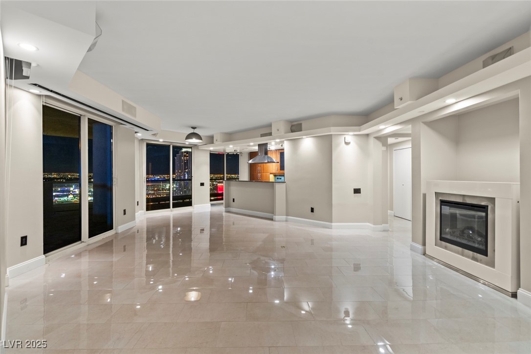 LARGE OPEN AND SPACIOUS LIVING, DINING AND KITCHEN AREAS. BEAUTIFUL NIGHT TIME VIEWS!!!