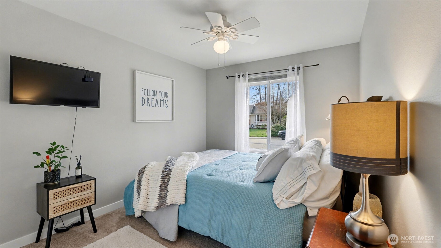 24912 168th Place Southeast Covington, WA 98042 - Photo 18 of 23 a bedroom with a bed a television and a window