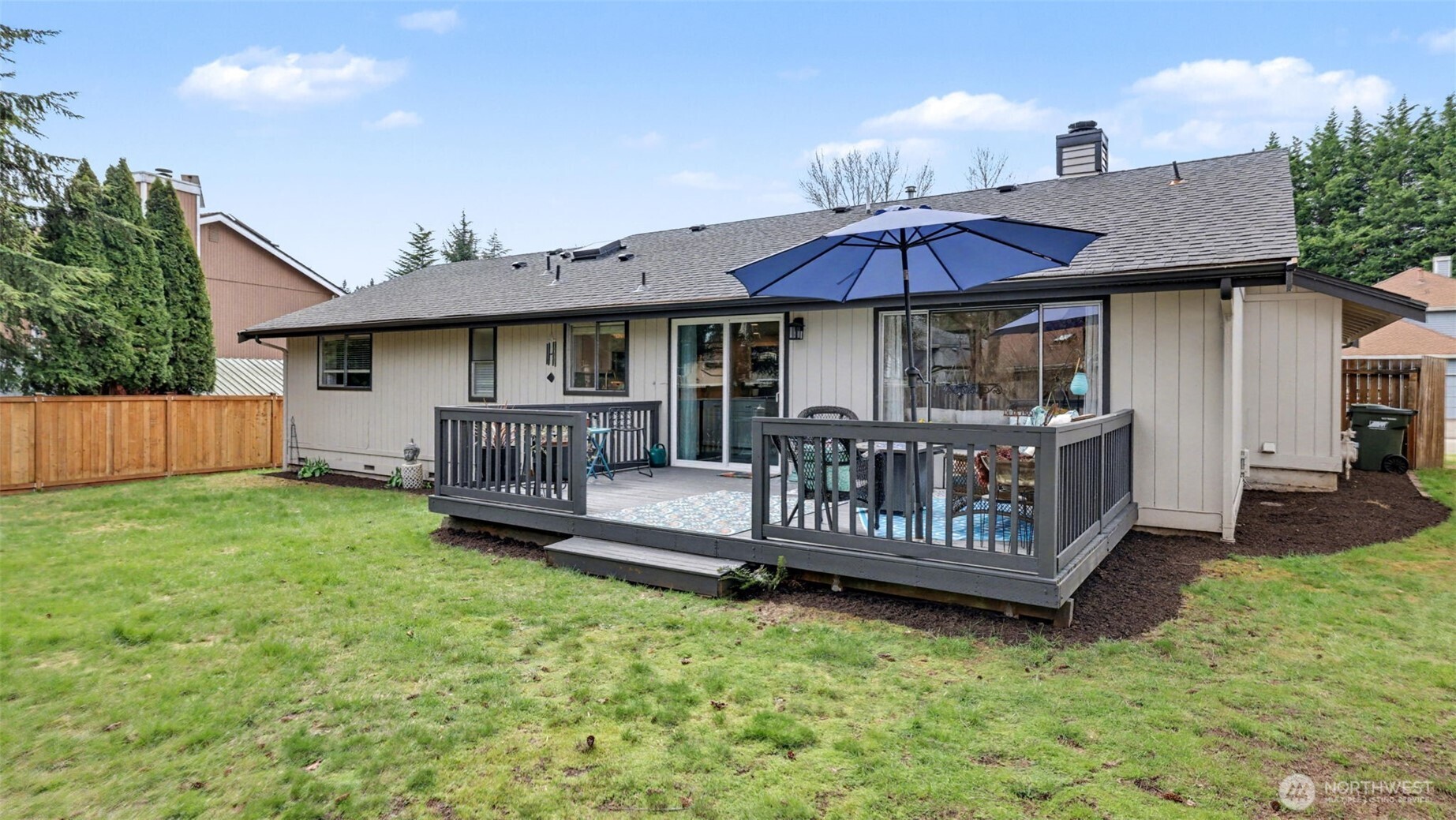 24912 168th Place Southeast Covington, WA 98042 - Photo 22 of 23 a view of a house with a deck and furniture