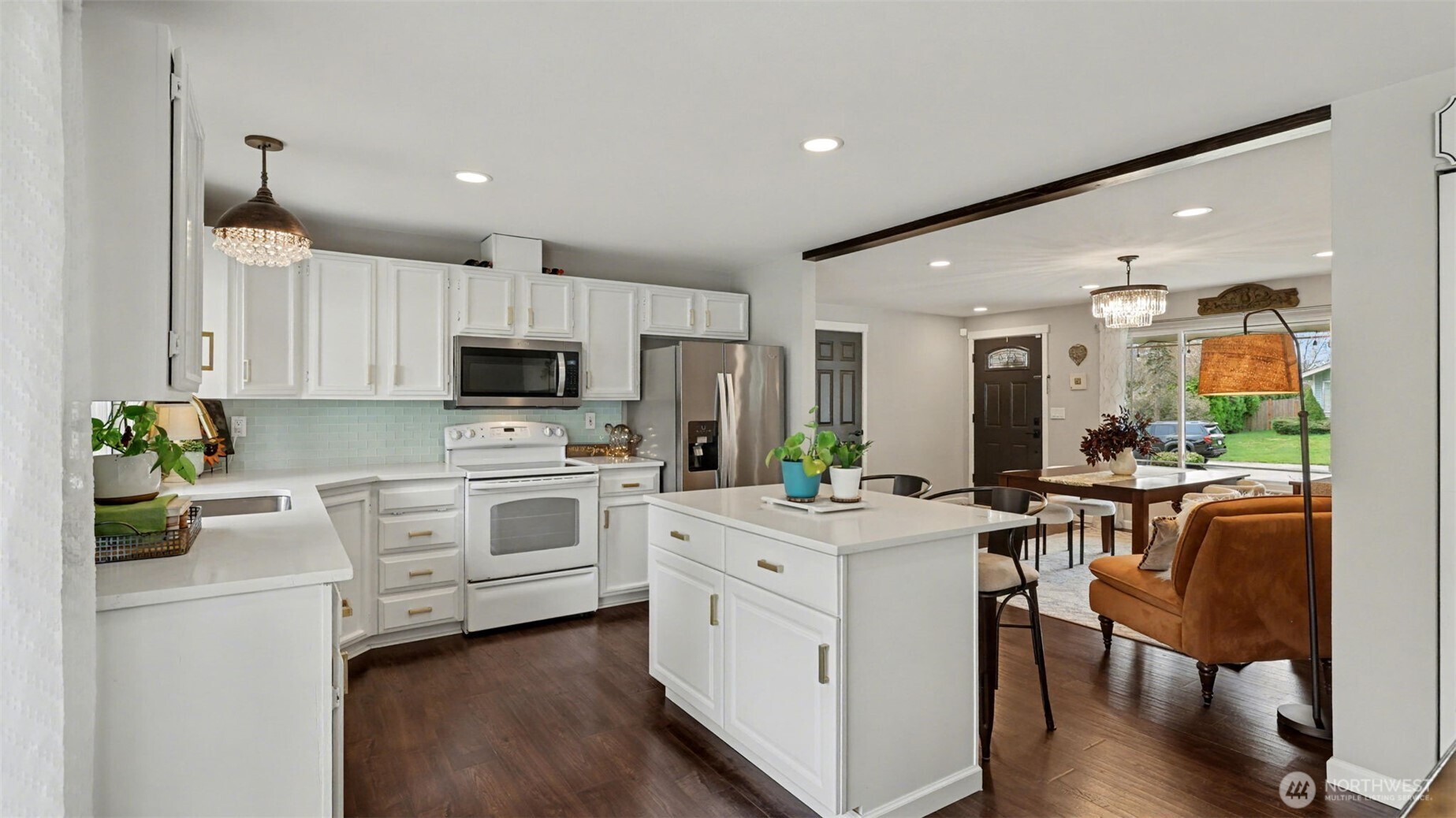 24912 168th Place Southeast Covington, WA 98042 - Photo 5 of 23 a kitchen with white cabinets and stainless steel appliances
