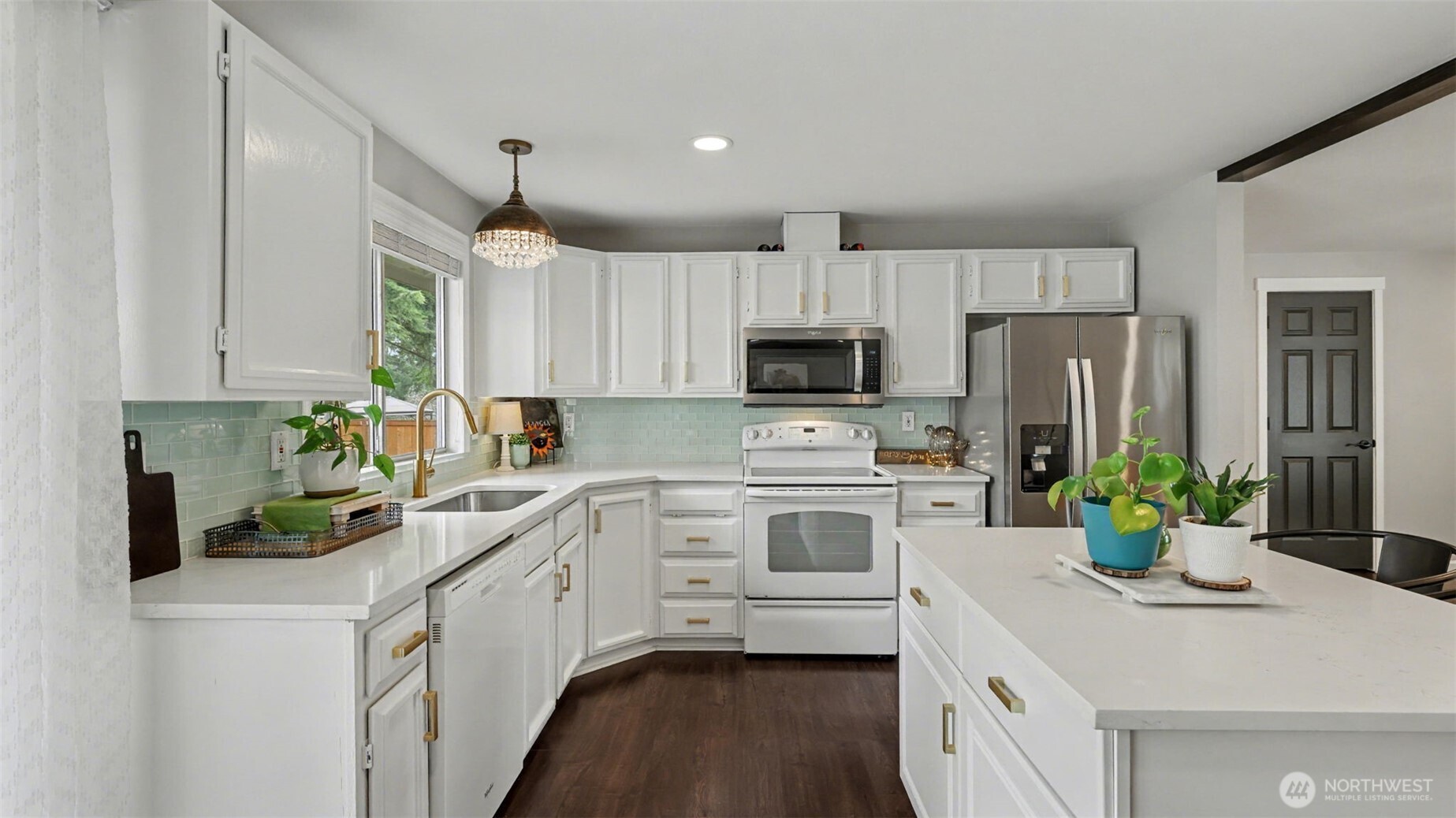 24912 168th Place Southeast Covington, WA 98042 - Photo 8 of 23 a kitchen with white cabinets and white appliances