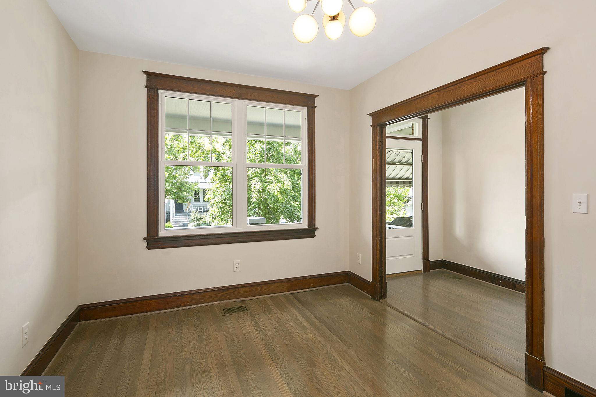 1242 Oates Street Northeast Washington, DC 20002 - Photo 12 of 47 an empty room with wooden floor and windows