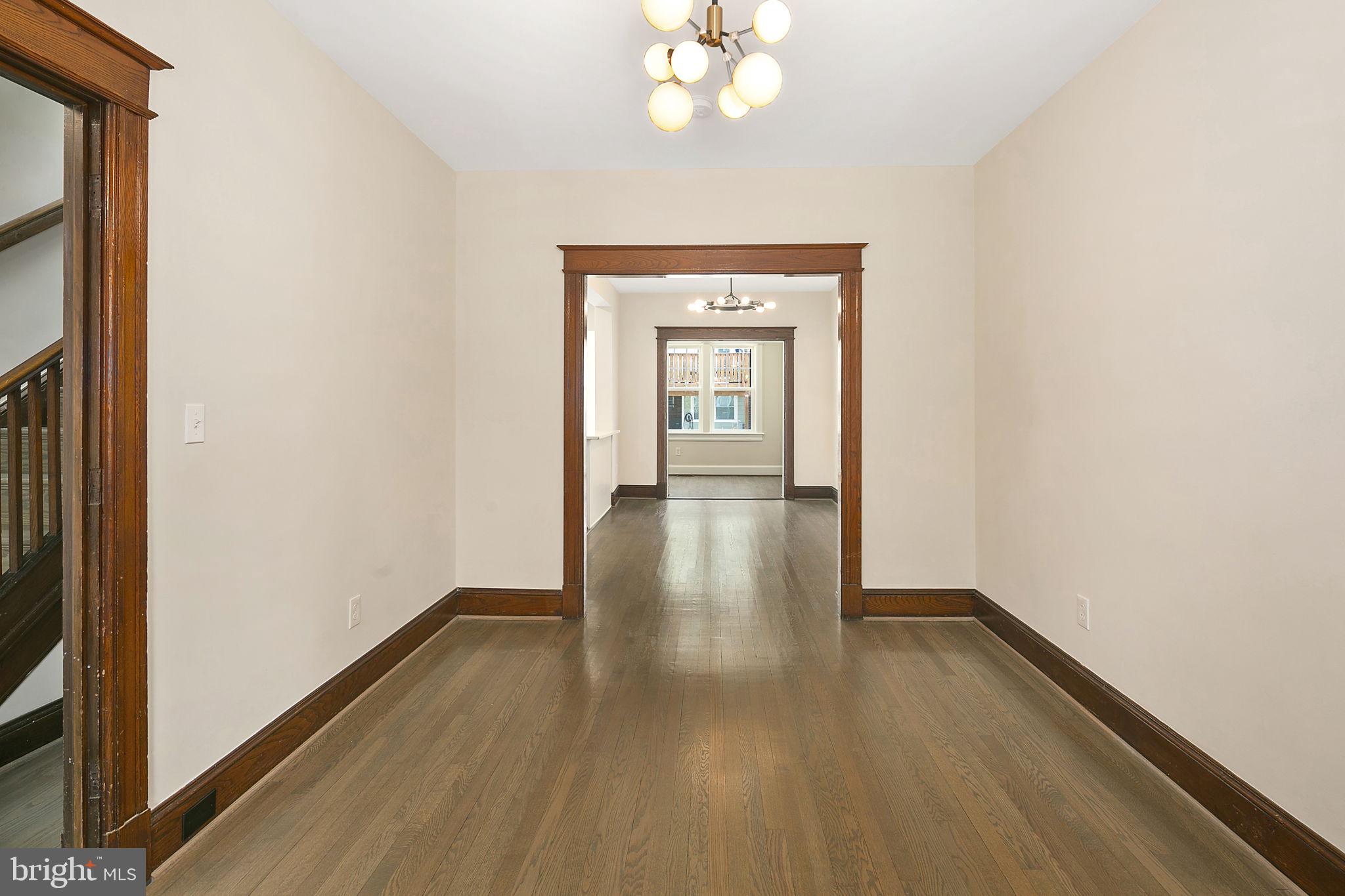 1242 Oates Street Northeast Washington, DC 20002 - Photo 13 of 47 a view of empty room with wooden floor