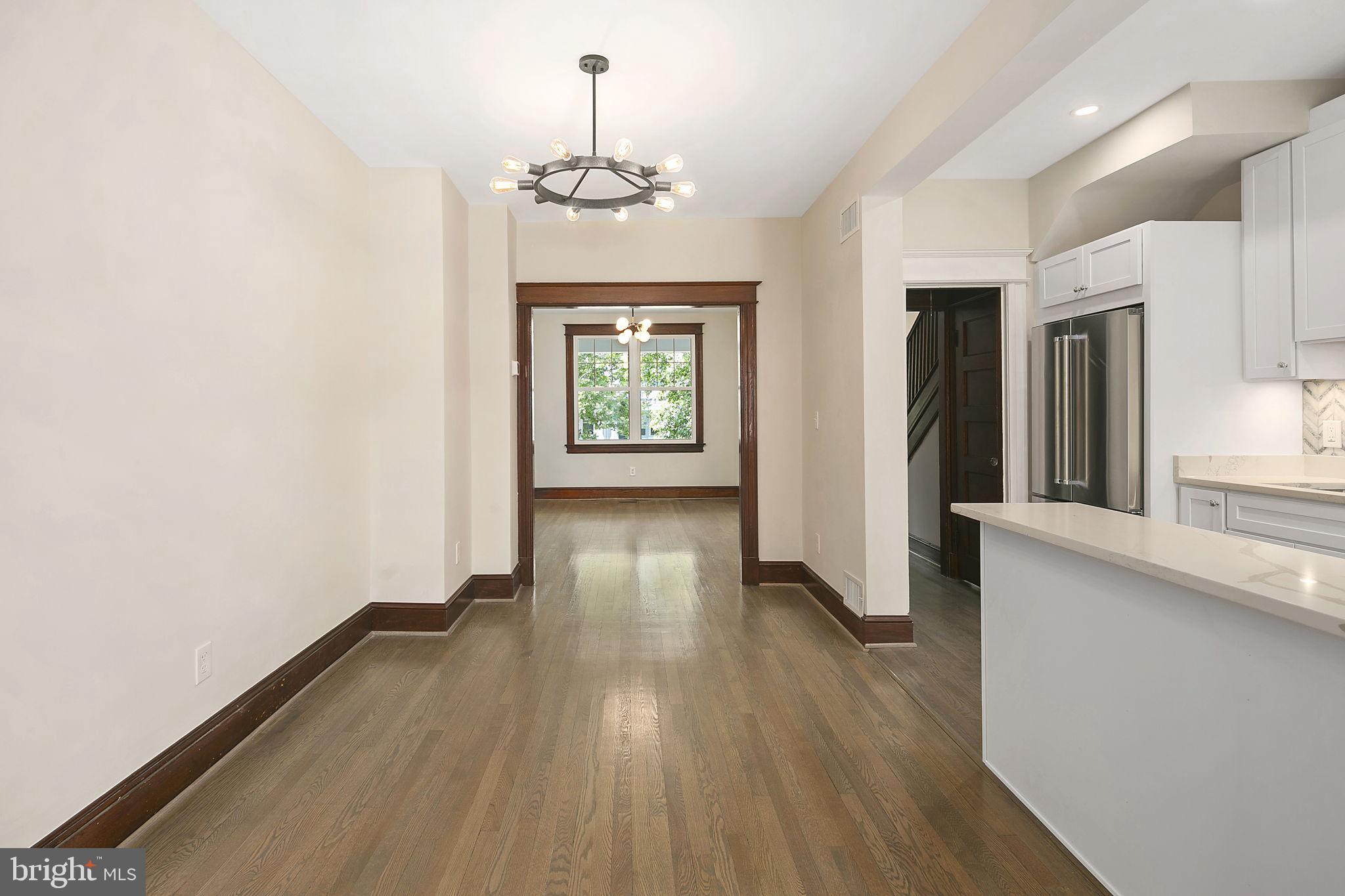 1242 Oates Street Northeast Washington, DC 20002 - Photo 18 of 47 a view of livingroom with hardwood floor and kitchen view