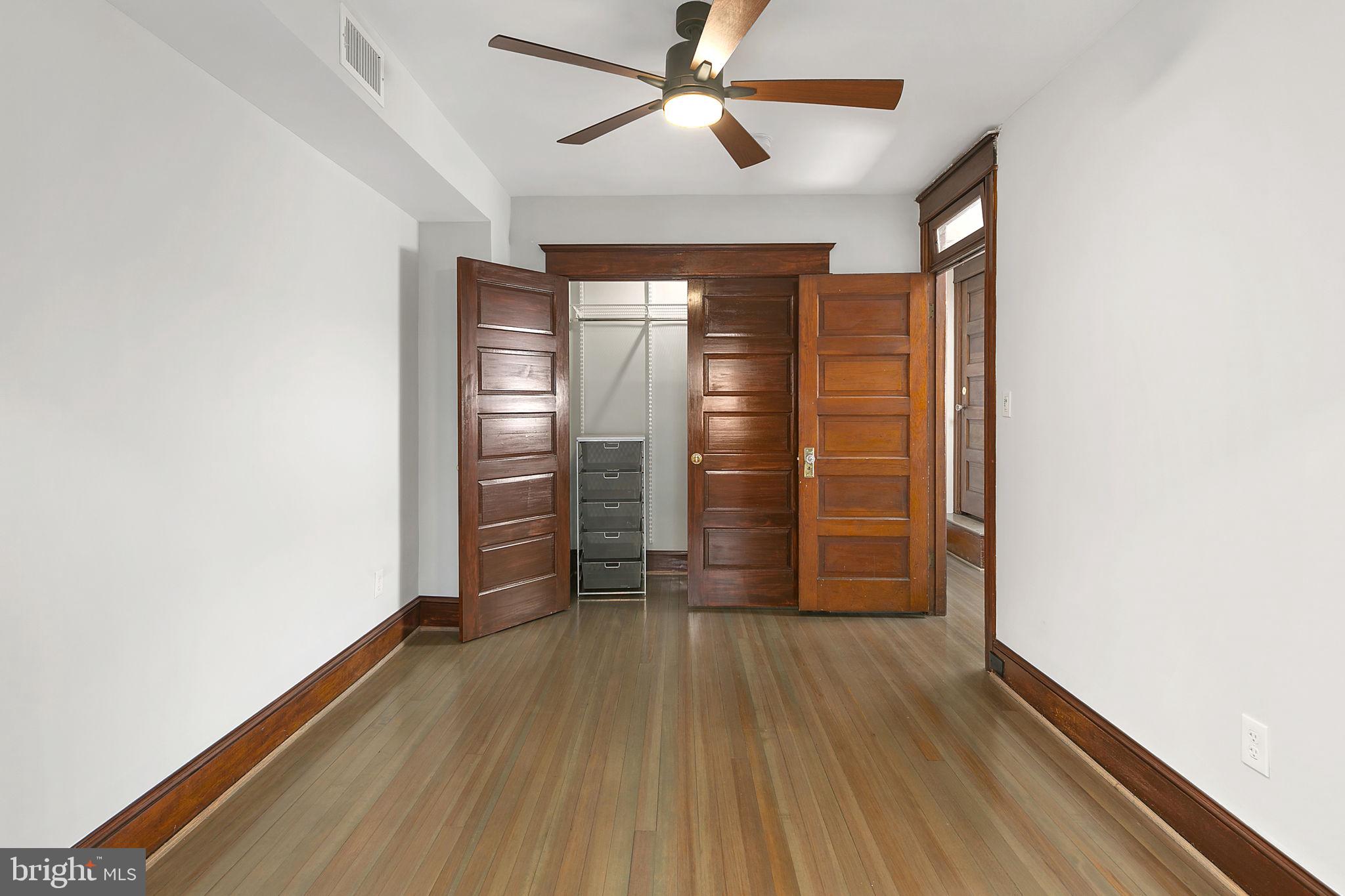 1242 Oates Street Northeast Washington, DC 20002 - Photo 25 of 47 wooden floor in an empty room with a window