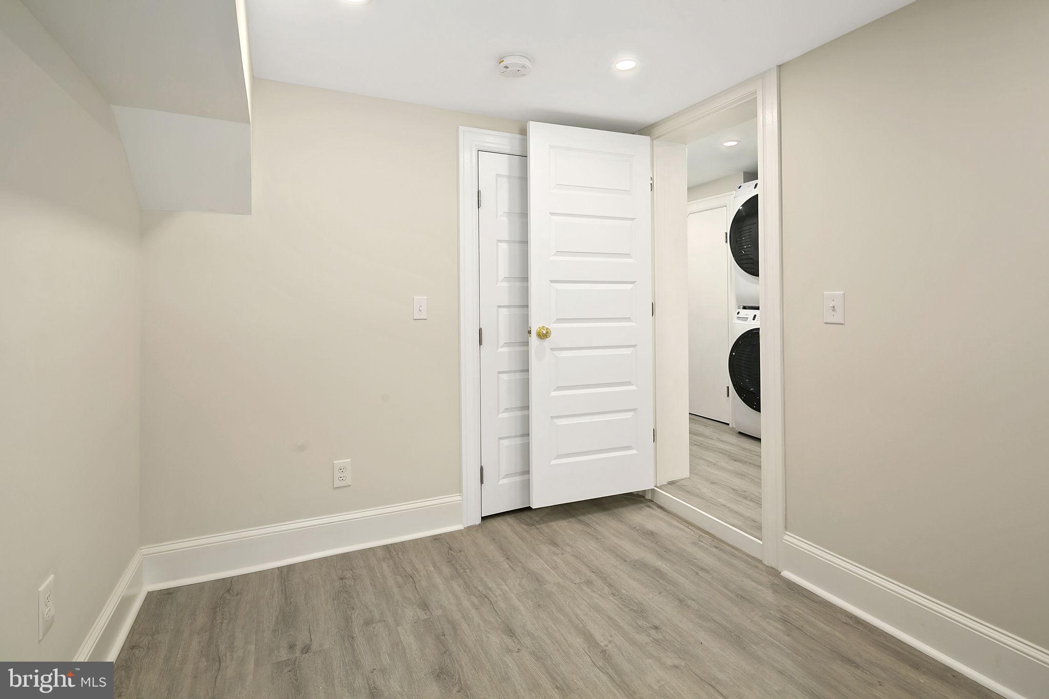 1242 Oates Street Northeast Washington, DC 20002 - Photo 32 of 47 wooden floor in an empty room