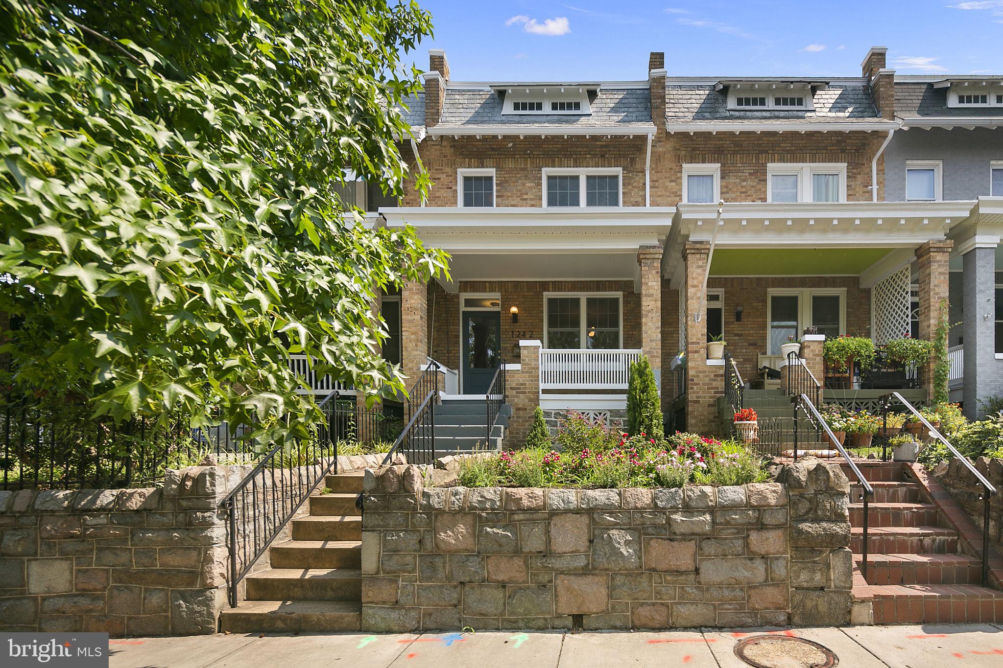 1242 Oates Street Northeast Washington, DC 20002 - Photo 35 of 47 a front view of a house with garden