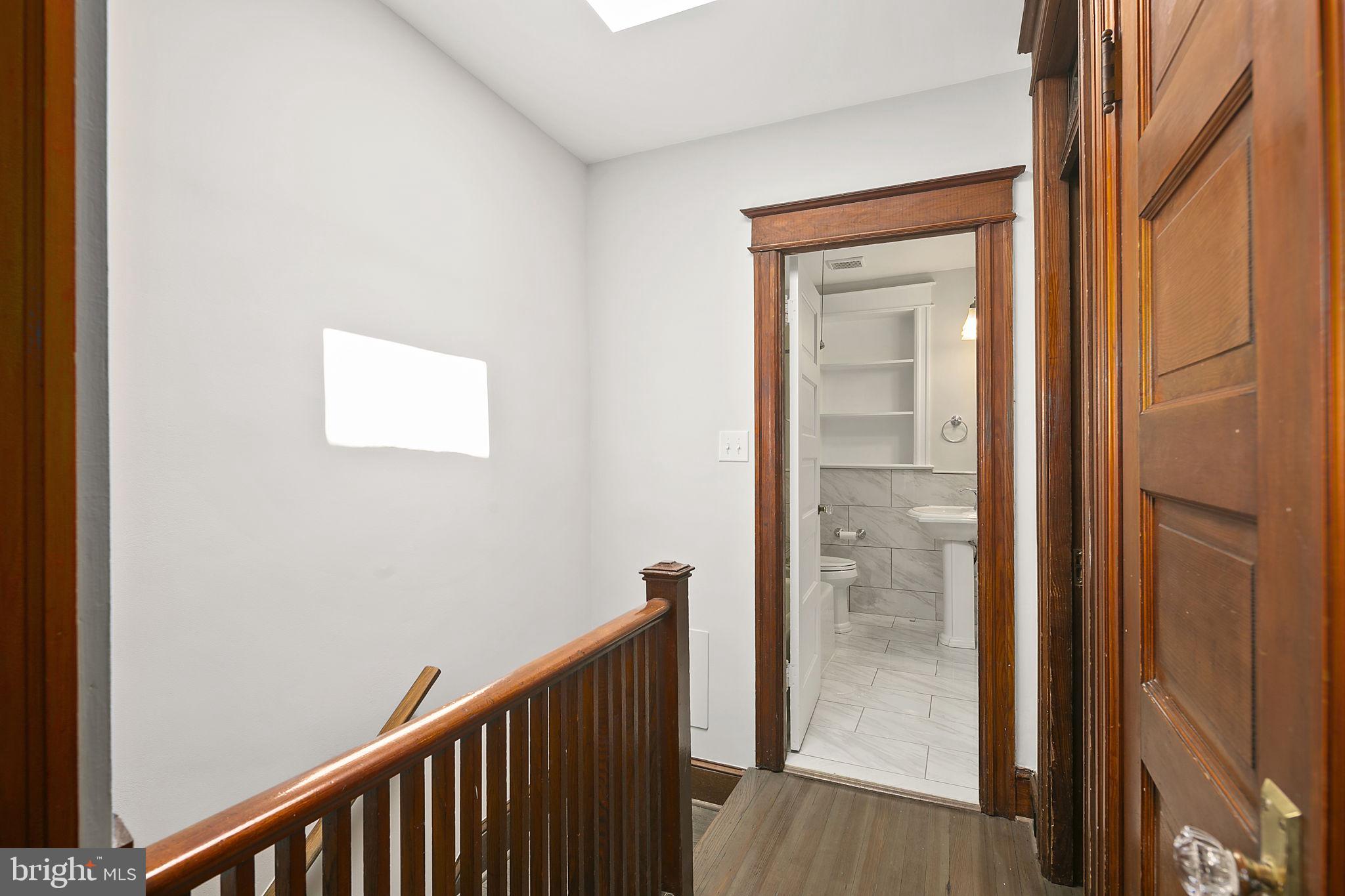 1242 Oates Street Northeast Washington, DC 20002 - Photo 39 of 47 a view of a hallway with wooden floor
