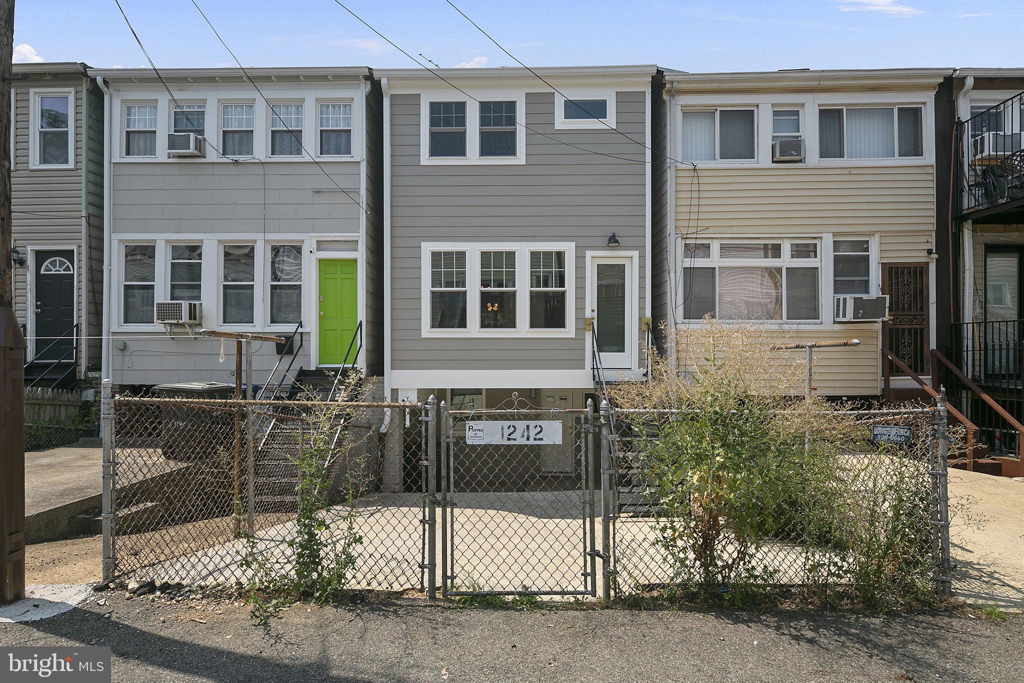 1242 Oates Street Northeast Washington, DC 20002 - Photo 46 of 47 a view of a brick house with many windows