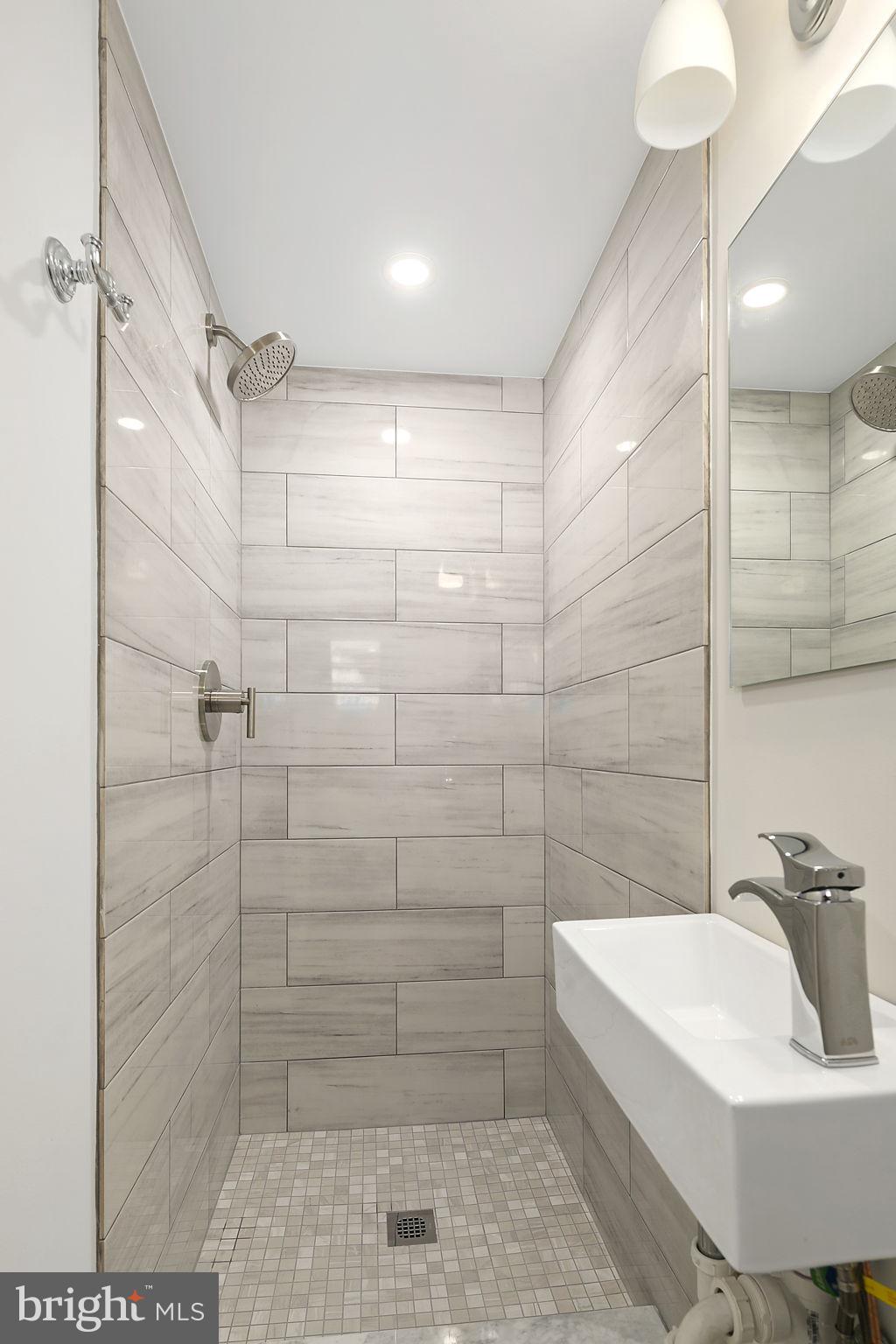1242 Oates Street Northeast Washington, DC 20002 - Photo 5 of 47 a bathroom with a bathtub and shower