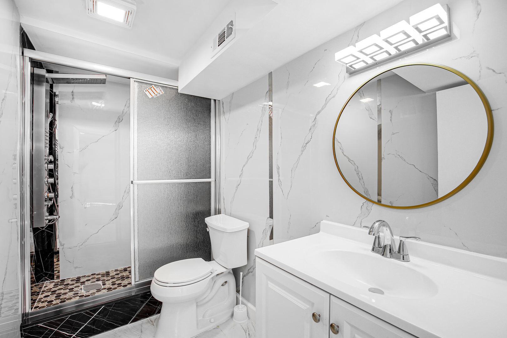 16779 92nd Avenue Orland Hills, IL 60487 - Photo 11 of 26 a bathroom with a sink toilet and shower