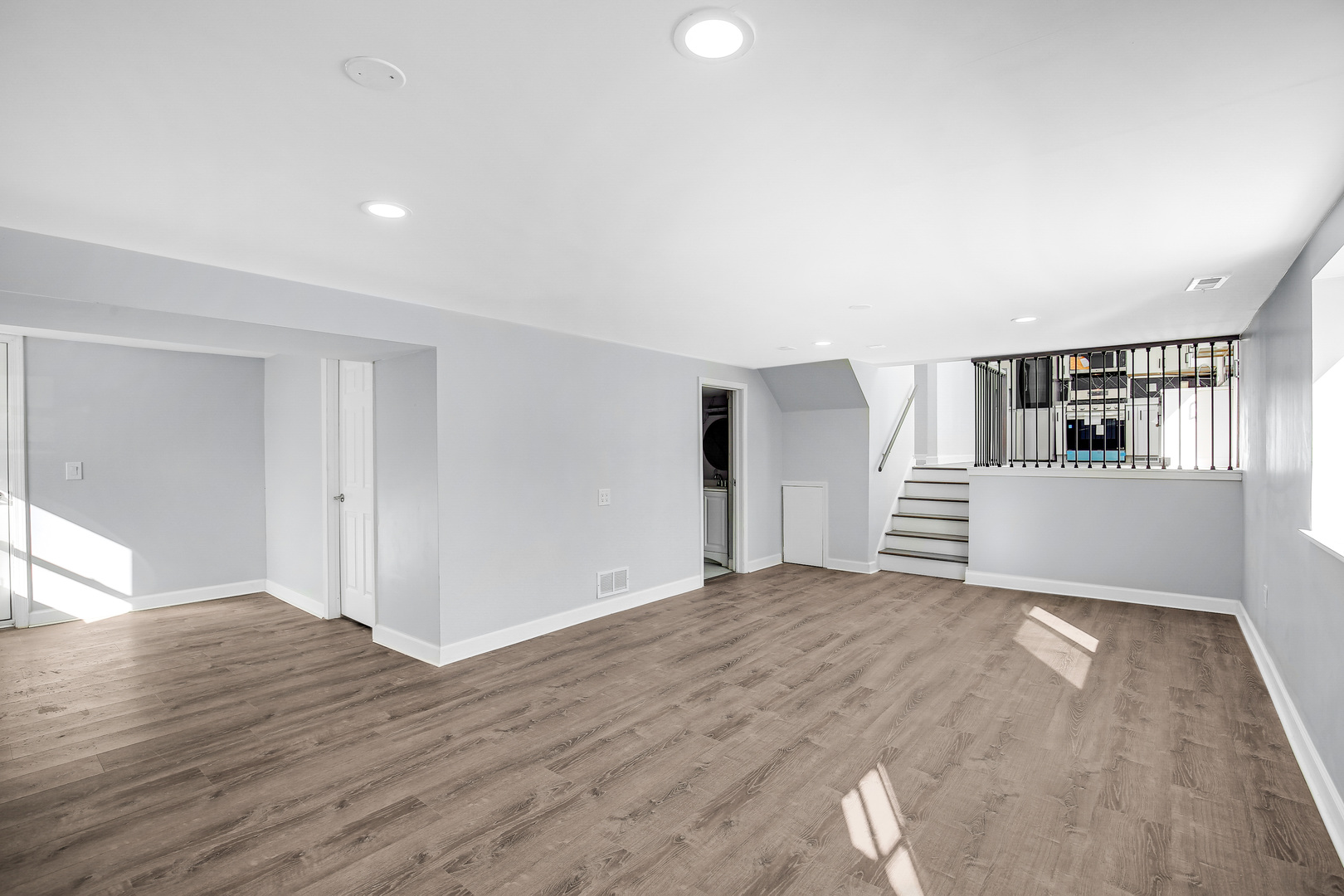 16779 92nd Avenue Orland Hills, IL 60487 - Photo 12 of 26 a view of an empty room with wooden floor and kitchen