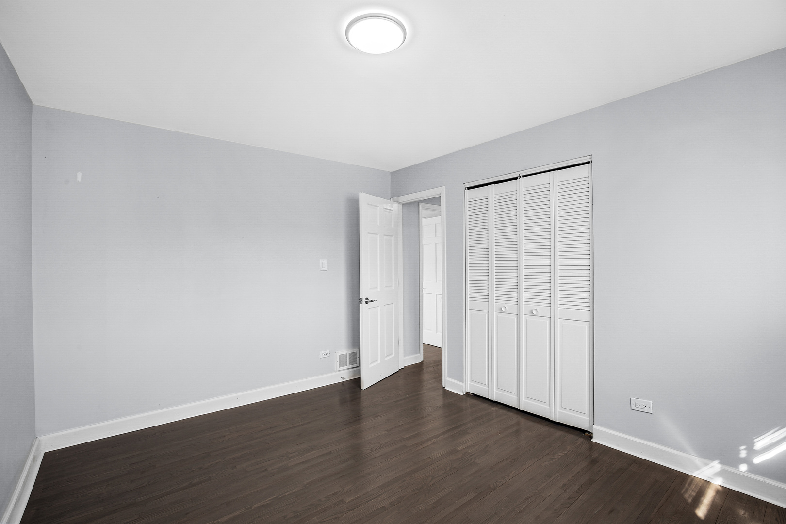 16779 92nd Avenue Orland Hills, IL 60487 - Photo 18 of 26 a view of an empty room with wooden floor