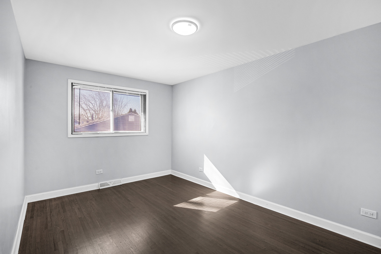 16779 92nd Avenue Orland Hills, IL 60487 - Photo 20 of 26 a view of empty room with wooden floor and fan