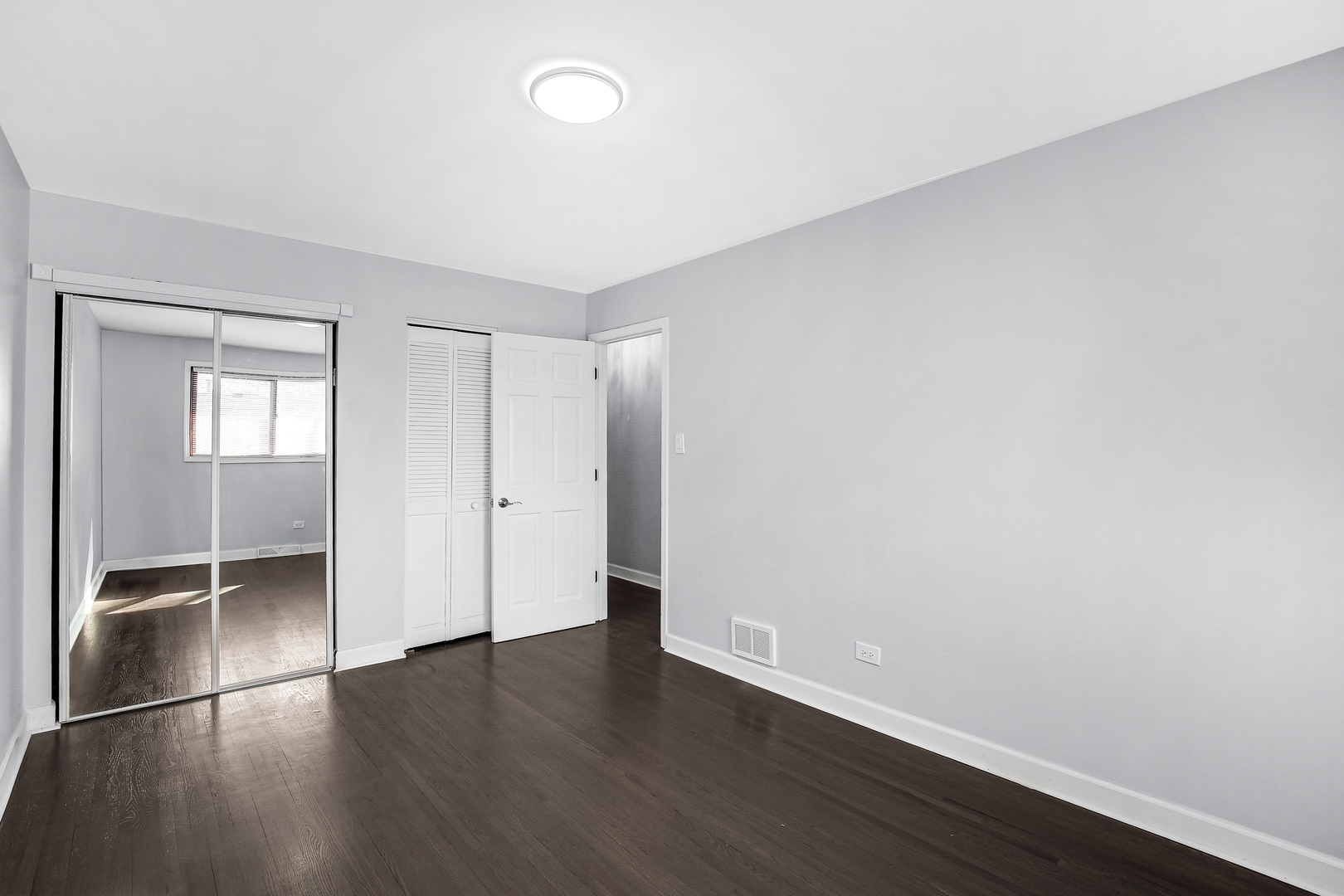 16779 92nd Avenue Orland Hills, IL 60487 - Photo 21 of 26 an empty room with wooden floor and windows