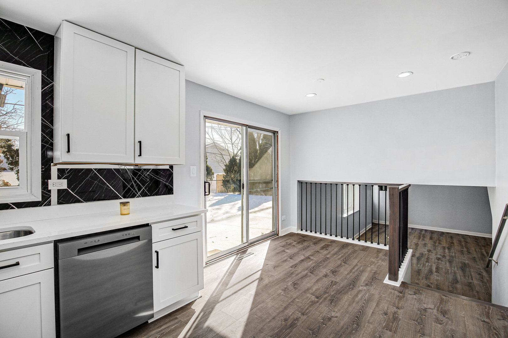 16779 92nd Avenue Orland Hills, IL 60487 - Photo 6 of 26 a kitchen with a refrigerator and white cabinets