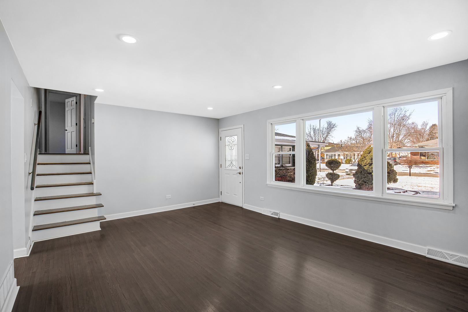16779 92nd Avenue Orland Hills, IL 60487 - Photo 8 of 26 an empty room with wooden floor and windows