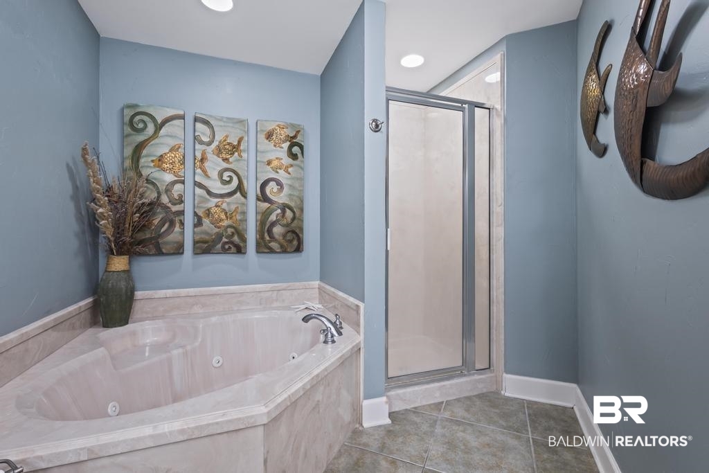 27582 Canal Road, Unit 2408 Orange Beach, AL 36561 - Photo 24 of 47 Bathroom with tile patterned floors and separate shower and tub