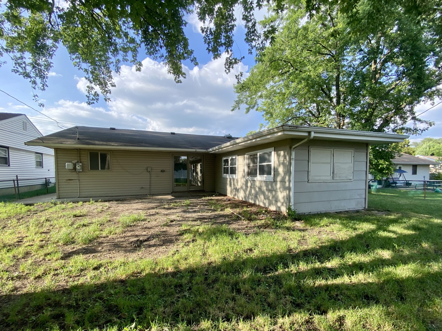 317 East Schaumburg Road Streamwood, IL 60107 - Photo 24 of 25 a view of a house with a yard