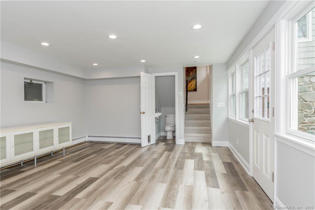 241 Maple Road Easton, CT 06612 - Photo 15 of 21 a view of an entryway with wooden floor and windows