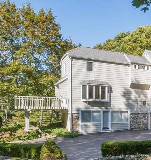 241 Maple Road Easton, CT 06612 - Photo 16 of 21 a front view of a house with a garden