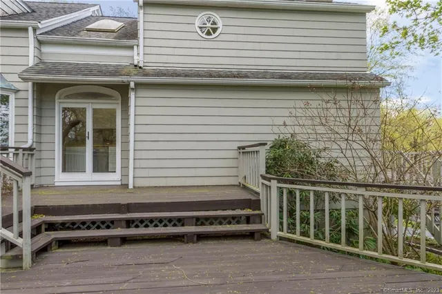 a view of balcony with wooden floor and outdoor seating