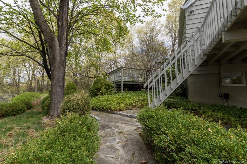 241 Maple Road Easton, CT 06612 - Photo 20 of 21 a backyard of a house with lots of green space
