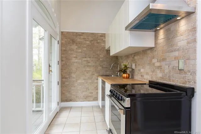 a kitchen with a stove and a sink