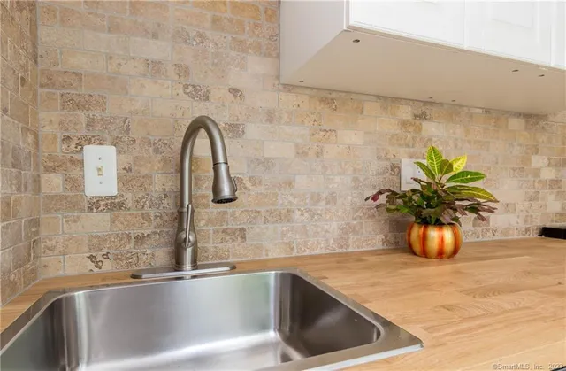 a white bath tub sitting next to a sink