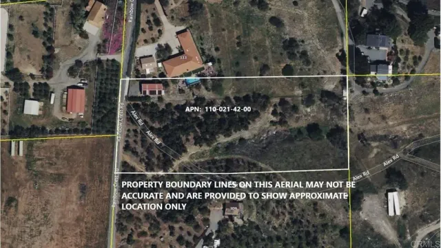 an aerial view of a houses with yard